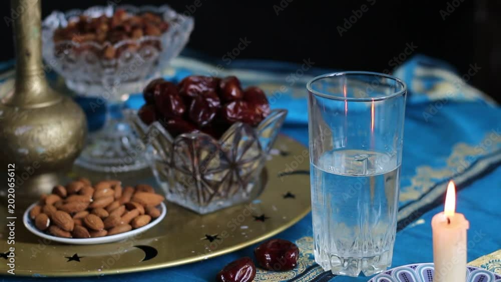 The pre-dawn meal of Suhur. Water and dates. Fasting in the Holy Muslim month of Ramadan The pre-dawn meal of Suhur. Water and dates. Fasting in the Holy Muslim month of Ramadan