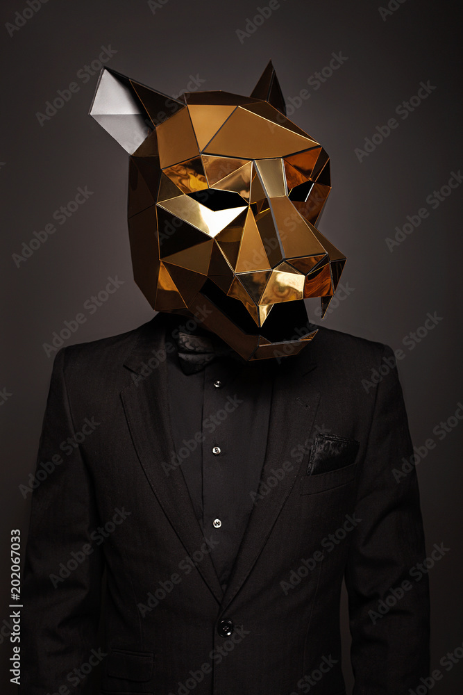 3d golden mirror mask in the form of a cat's head is dressed for a man in a  black suit Stock Photo | Adobe Stock