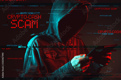 Crypto cash concept with faceless hooded male person