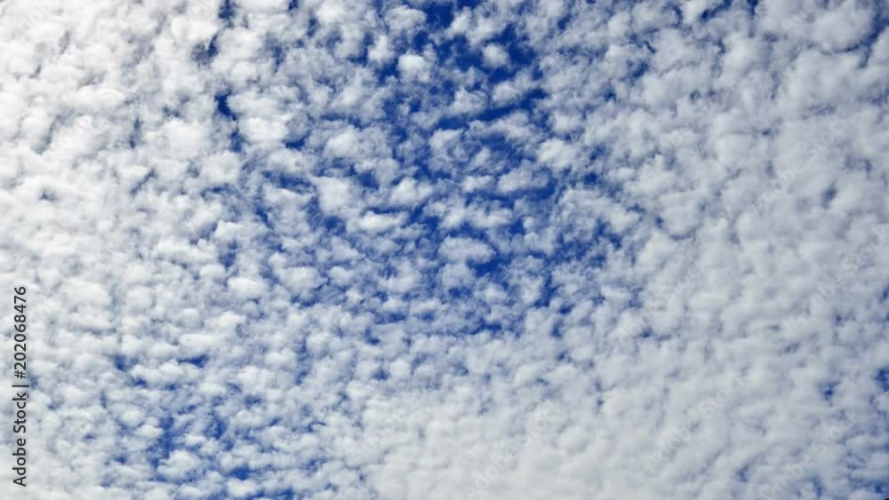 Amazing Time lapse clip of white fluffy clouds over blue sky Amazing Time lapse clip of white fluffy clouds over blue sky