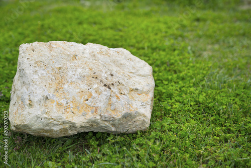 stone over grass