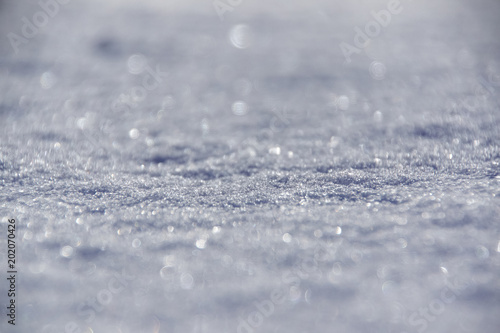 Closeup of frozen snowflakes on grassland  ground