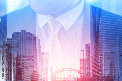 successful business ideas concept with businessman in suit double exposed with city bridge image