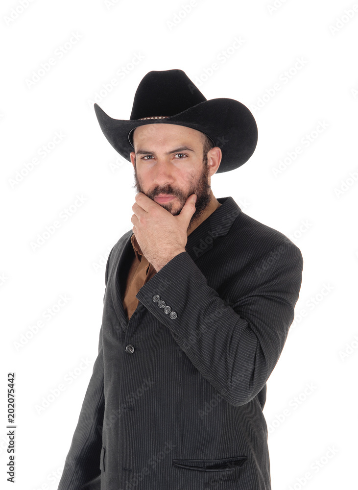 Man in gray jacket and cowboy hat, hand on face Man in gray jacket and cowboy hat, hand on face