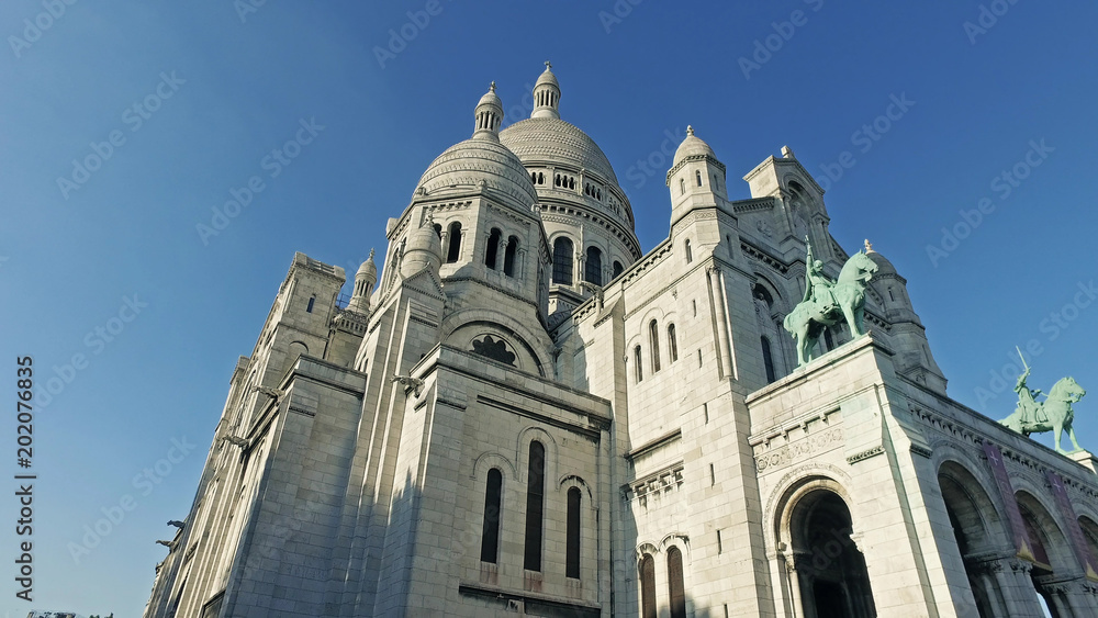 Outdoor facade of Basilica of Sacre-Coeur in Montmartre, Paris, France, cinematic steadicam view