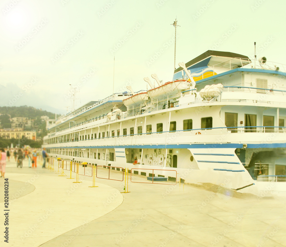 Fototapeta premium The sea is blue. An old boat is transporting people