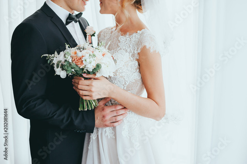 beautiful bride and groom posing at the hotel