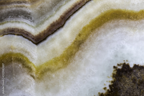 Macro photo texture of polished onyx stone. Photo for the site about geology, stones, jewelry, handwork, textures, art.