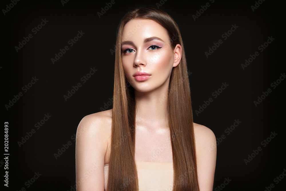 Beautiful woman portrait on black background with beautiful straight hair. Beautiful woman portrait on black background with beautiful straight hair.