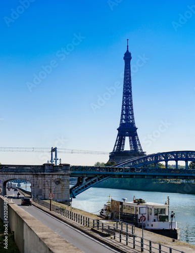 View at Eiffel tower and railway bridge Rouelle crossing Swan Island.On the road are moving vehicles