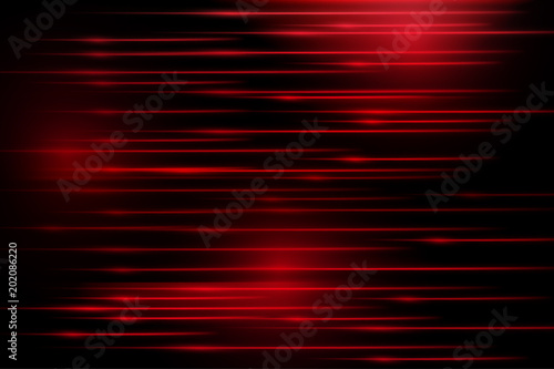 Red glowing lines on a black background. Modern abstract background in high-tech style.