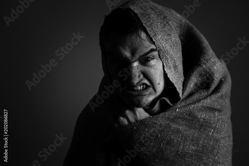 Anger man covered by fabric. Black and white