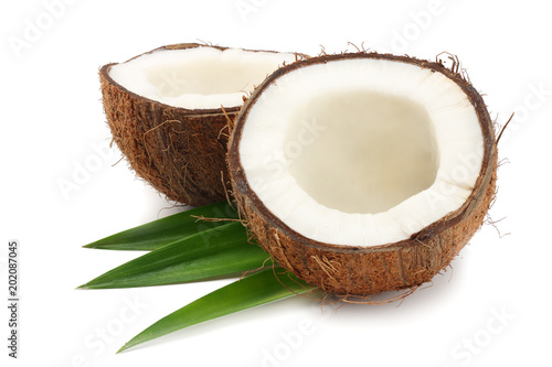 Coconut with green leaves isolated on white background
