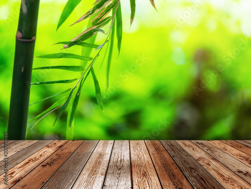 Wooden table on bamboo plant background