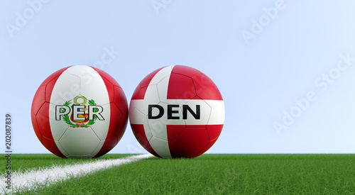 Peru vs. Denmark Soccer Match - Soccer balls in Peruvian and Denmarks national colors on a soccer field. Copy space on the right side - 3D Rendering 