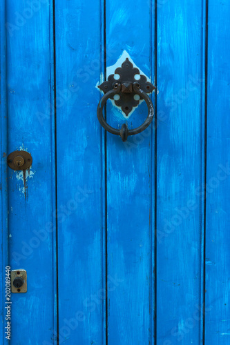 Detail of colorful traditional wooden door © elenatiniakou