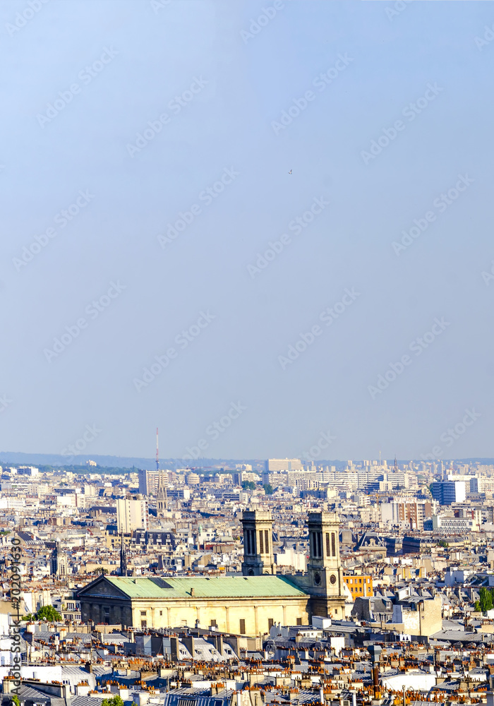 Aerial view over rooftops of Eglise Saint Vincent de Paul cathedral in Paris, France, seen from Monmartre hill, vertical Aerial view over rooftops of Eglise Saint Vincent de Paul cathedral in Paris, France, seen from Monmartre hill, vertical