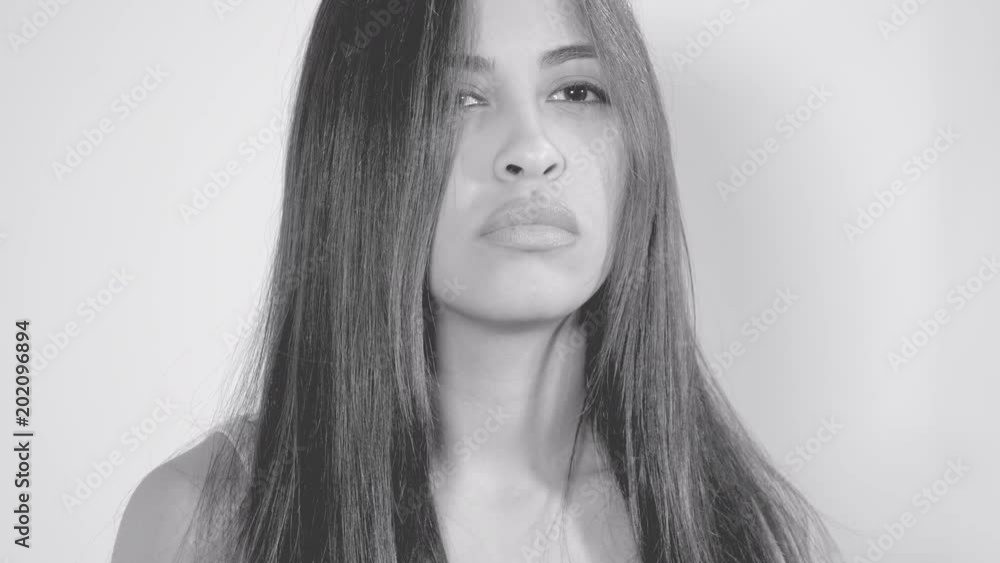 Sad hispanic female model unhappy black and white washed out Sad hispanic female model unhappy black and white washed out