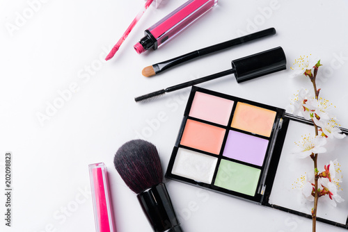 Makeup accessories copy space on white background.
