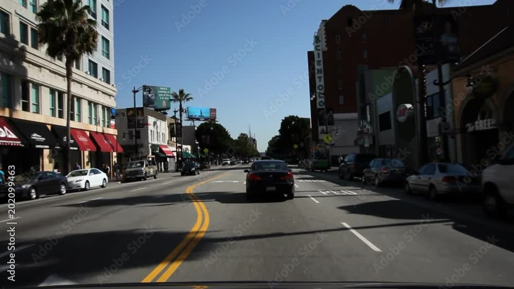 Driving on Hollywood Boulevard, past Guinness Museum, old Christie Hotel, and Egyptian Theater Driving on Hollywood Boulevard, past Guinness Museum, old Christie Hotel, and Egyptian Theater