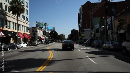 Driving on Hollywood Boulevard, past Guinness Museum, old Christie Hotel, and Egyptian Theater photo