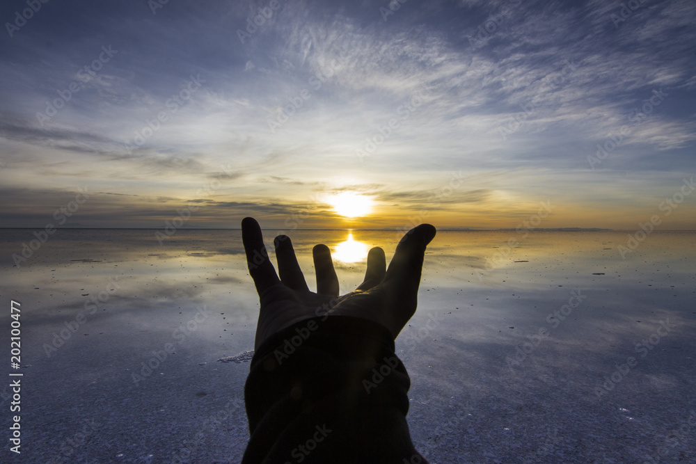 Uyuni reflections are one of the most amazing things that a photographer can see. Here we can see how the sunrise over an infinite horizon with the Uyuni salt flats making a wonderful mirror.