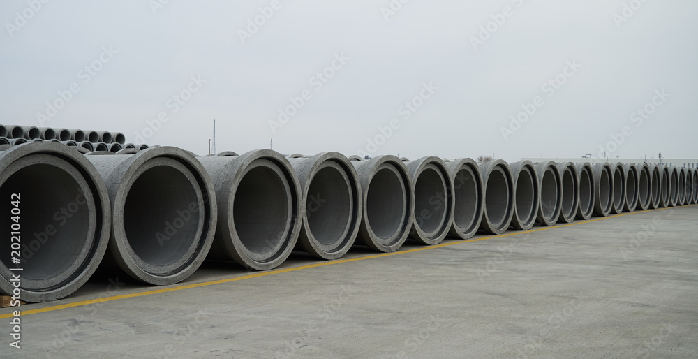 Concrete pipe factory warehouse. Industry manufacturing concept Concrete pipe factory warehouse. Industry manufacturing concept