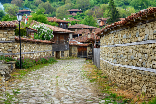 Zheravna, Bulgaria - architectural reserve of rustic houses and narrow cobbled streets from the Bulgarian national revival period photo