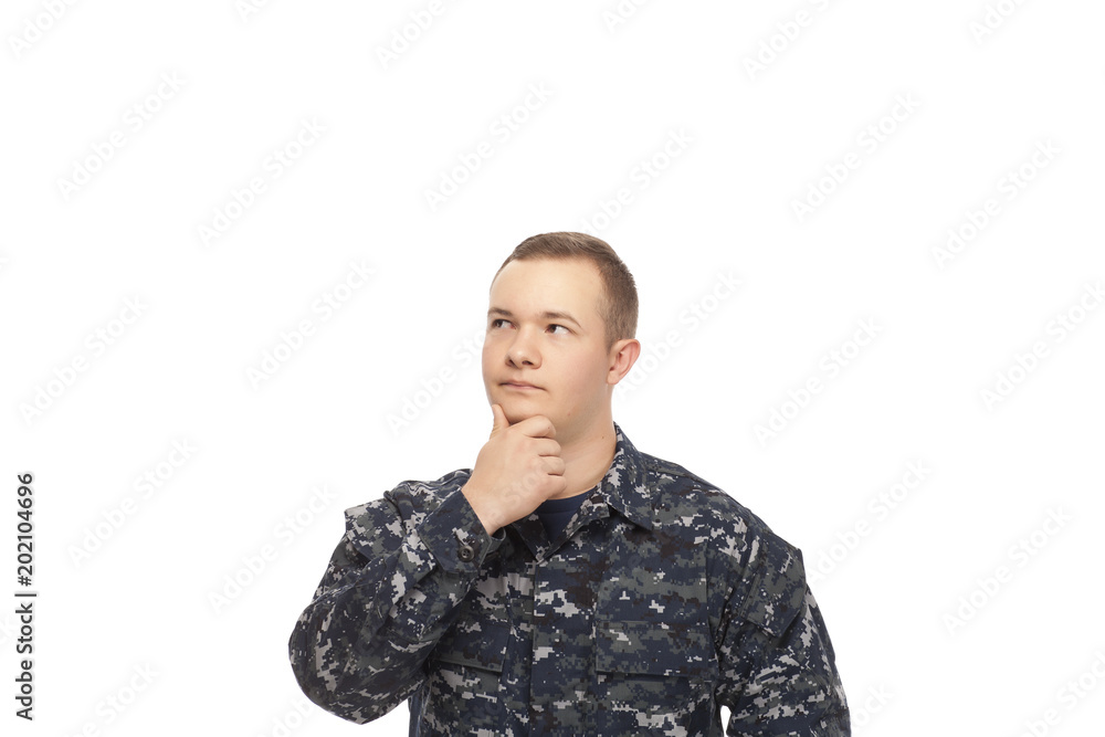 Young man in navy uniform thinking Young man in navy uniform thinking