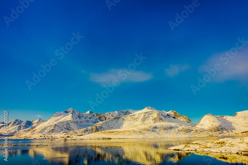 View of mountain reflecting in the water on Lofoten islands