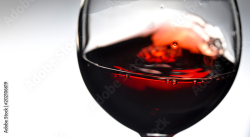 Red wine in wineglass. Closeup.