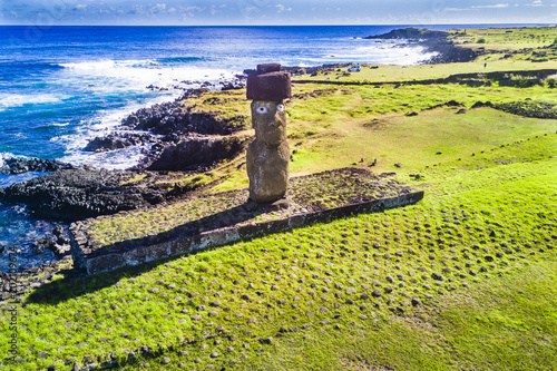 Ahu Tahai alone Moai at Hanga Roa, Easter Island. This is the only one with painted eyes like it was on the past. photo