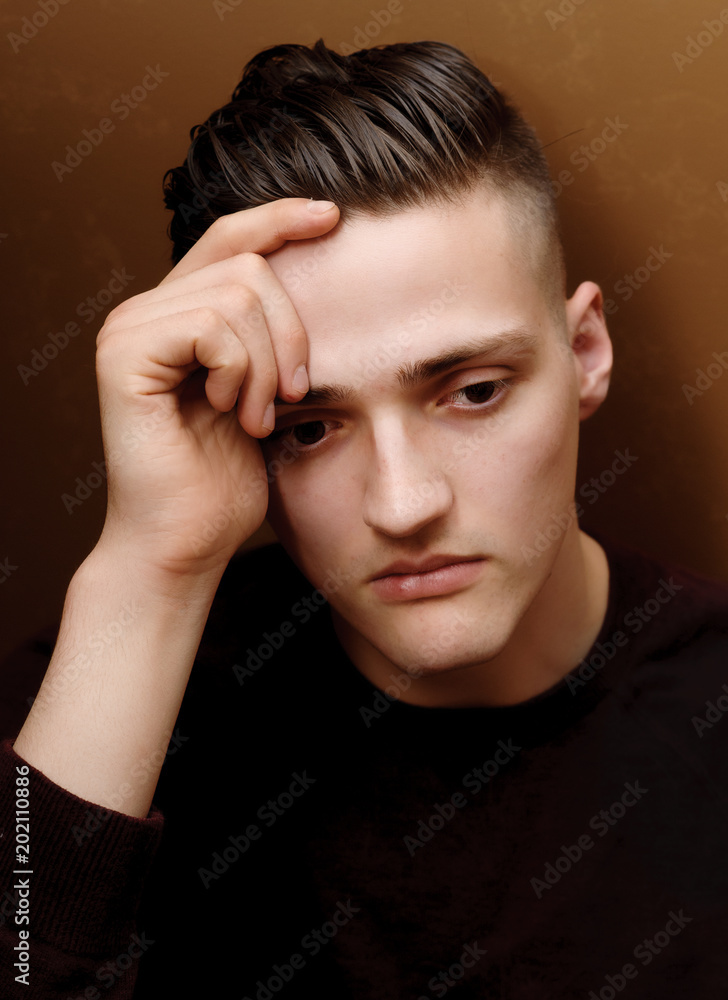 Worried young male student is unclear about his future Worried young male student is unclear about his future