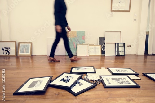 Photo frames on wooden floor