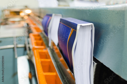 Fotografija Print shop, detail of book finishing perfect bound machine