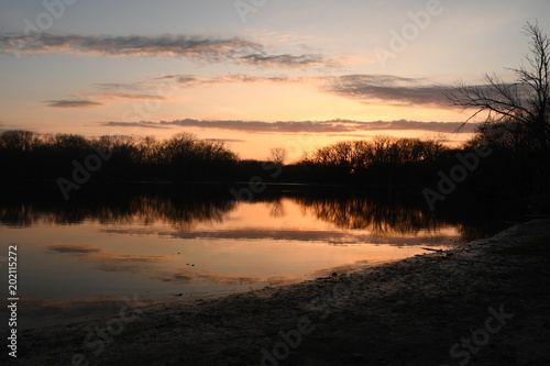 Sunset on the lake tree reflection