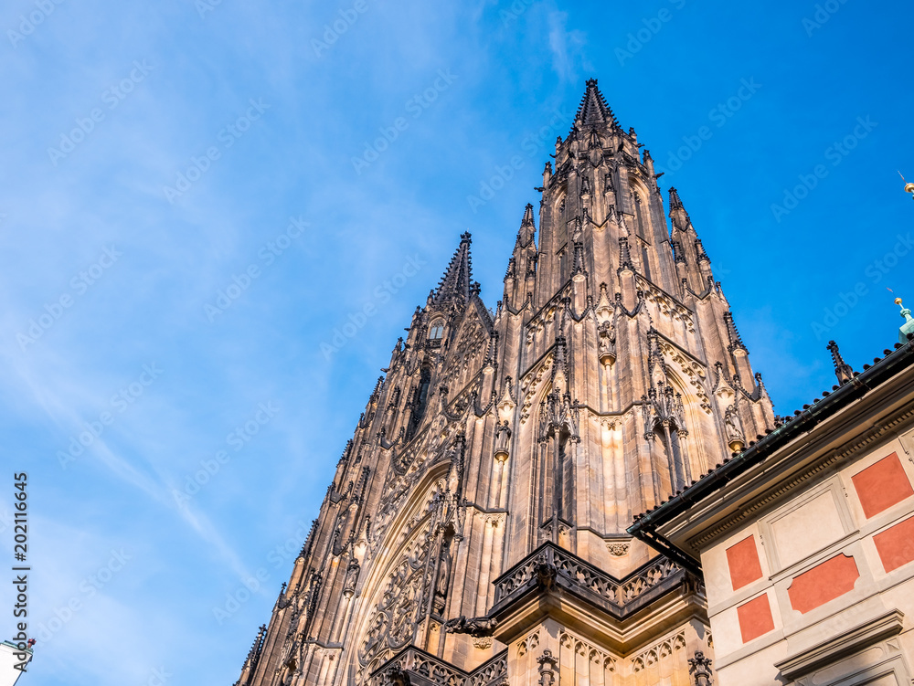 Fototapeta premium St. Vitus cathedral in Prague Castle front view of the main entrance in Prague, Czech Republic.Blue sky sunny background winter season.Landmark historical destination travel.