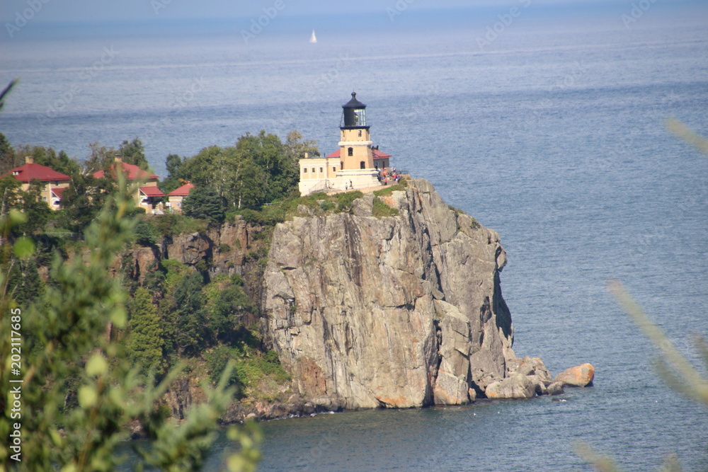 Lighthouse on a cliff overlooking the water
