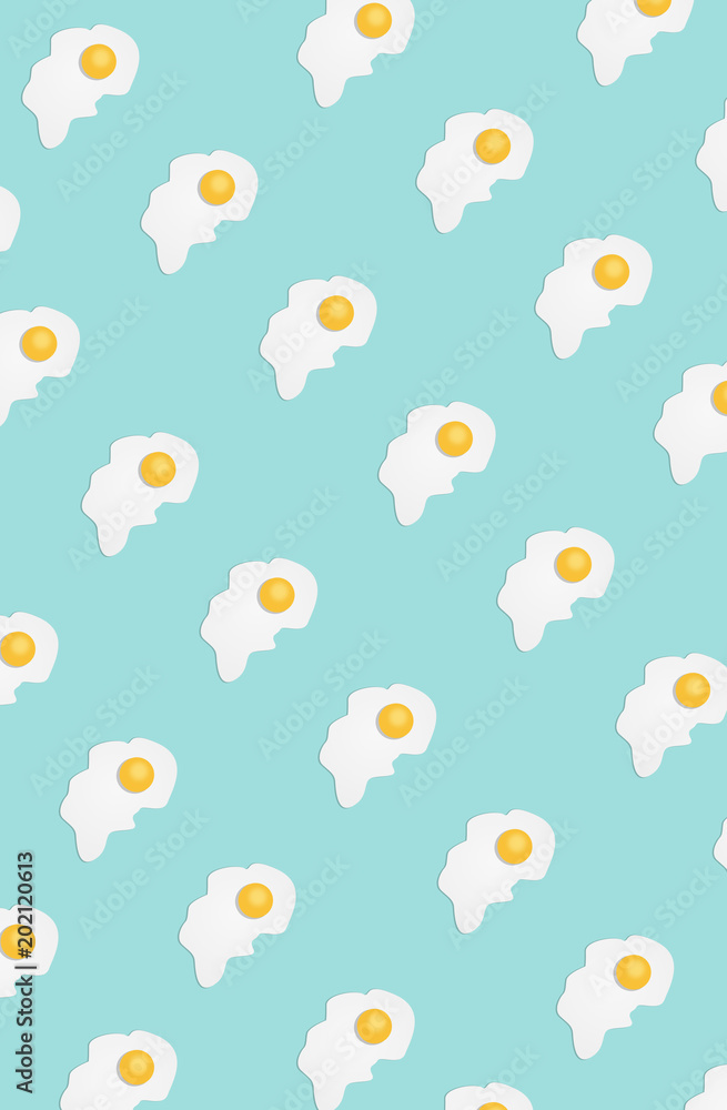 Broken egg on a light blue background