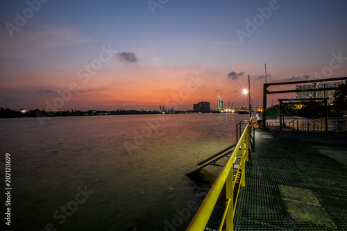 The sun is in the evening. The Chao Phraya River (Wat Pariwat) Bangkok Thailand © bangprik