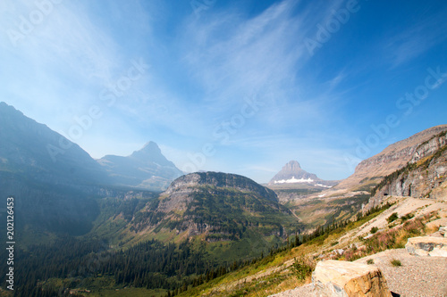 BEARHAT MOUNTAIN AT THE TOP OF LOGAN PASS ON THE GOING TO THE SUN HIGHWAY UNDER CIRRUS CLOUDS DURING THE 2017 FALL FIRES IN GLACIER NATIONAL PARK IN MONTANA UNITED STATES