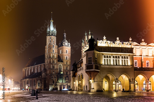 St. Marys Basilica at night, with night lamp visibleand dramatic lights, Krakow, Poland. Light leak
