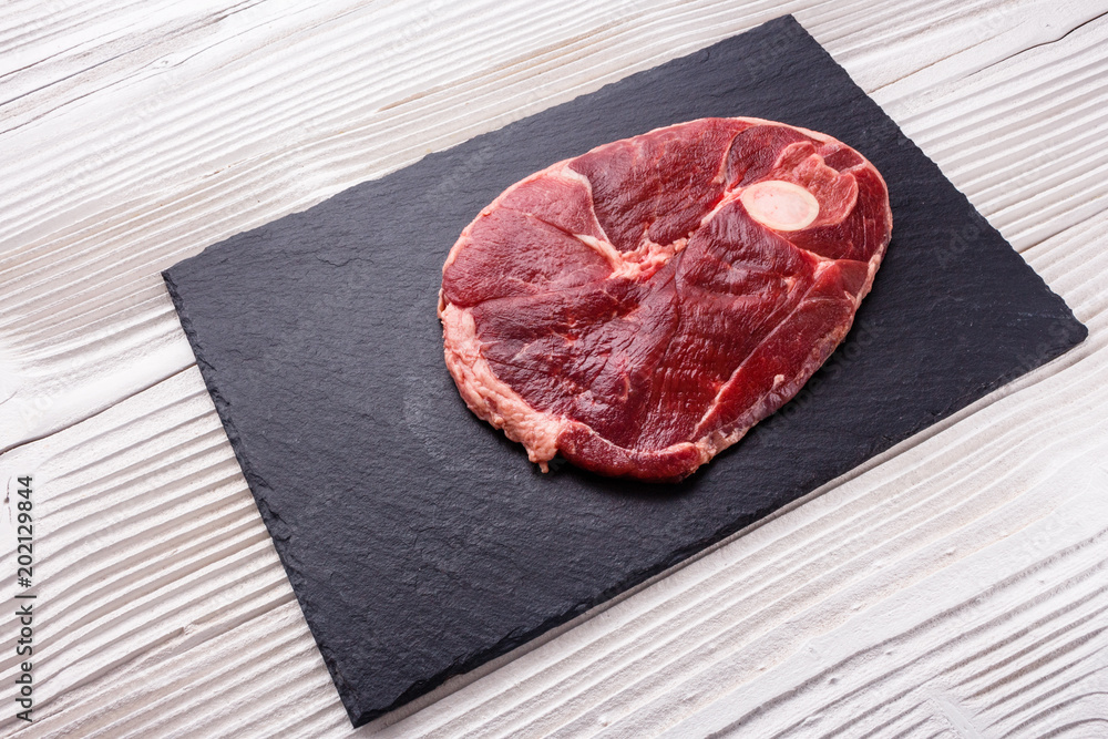 fresh lamb meat on a textured stone plate fresh lamb meat on a textured stone plate