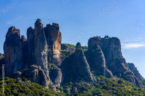 Mountain scenery with the rocks of Meteora, Greece in the morning haze, cloudless sky