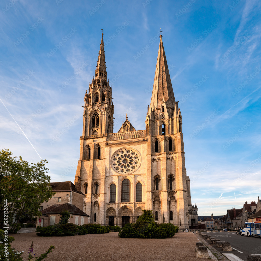 View of Chartres Cathedral West facade in sunset rays