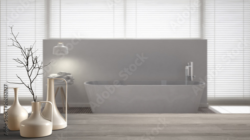 Wooden table top or shelf with minimalistic modern vases over blurred scandinavian clean bathroom  white interior design