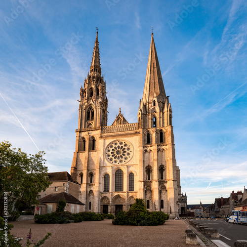 View of Chartres Cathedral West facade in sunset rays photo