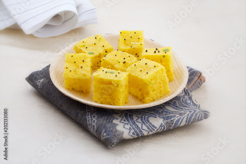 Indian Traditional Street Food Khaman Dhokla Served With Chutney & Chilli photo