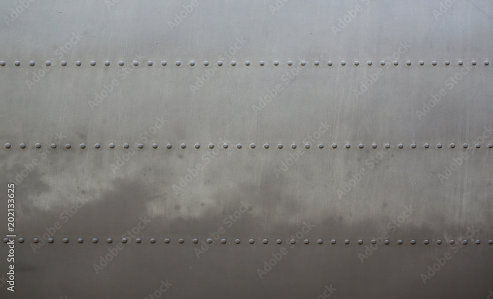 Metal surface background of military aircraft with cover.
