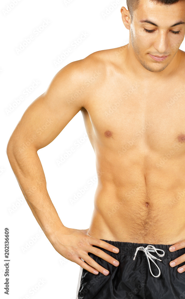 Topless young man bodybuilder posing isolated on white background